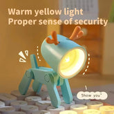 Cute deer LED night light on child bedside table providing gentle comfort lighting